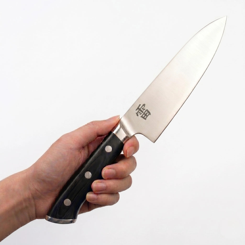 Kaminari 8-inch professional chef knife in use on kitchen cutting board