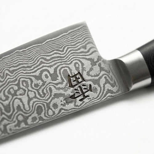 Kaminari Damascus chef knife blade close-up showing layered Damascus steel pattern