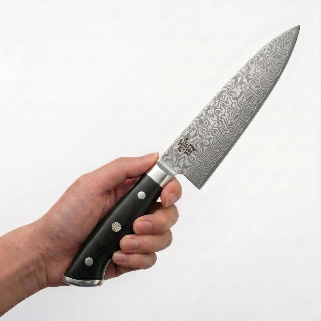 Kaminari 8-inch Damascus chef knife lifestyle shot in professional kitchen